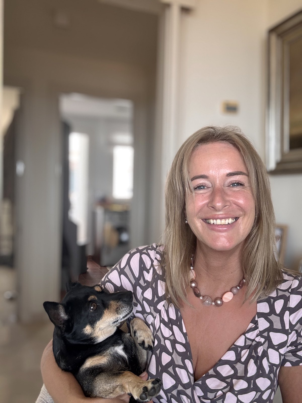 Valerie Nuyttens holding her dog indoors